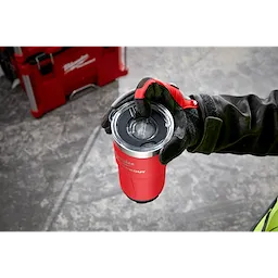Worker aligning the arrows on the lid and lid cover of the PACKOUT Tumbler with one hand
