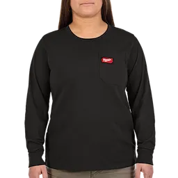 A woman wearing a black, long-sleeve shirt with a red Milwaukee Tool logo on the left chest pocket stands against a white background. She has long, brown hair and beige pants.