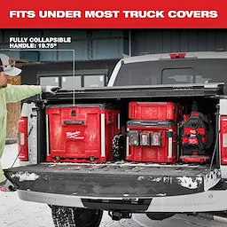 The App%20Shot%20Feature box, labeled "Fully Collapsible Handle: 19.75 inches," fits neatly under most truck covers in a red truck bed.