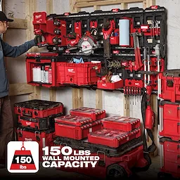 PACKOUT Large Wall Plate loaded with various red toolboxes, power tools, and accessories mounted on a wall, 150 lbs capacity.