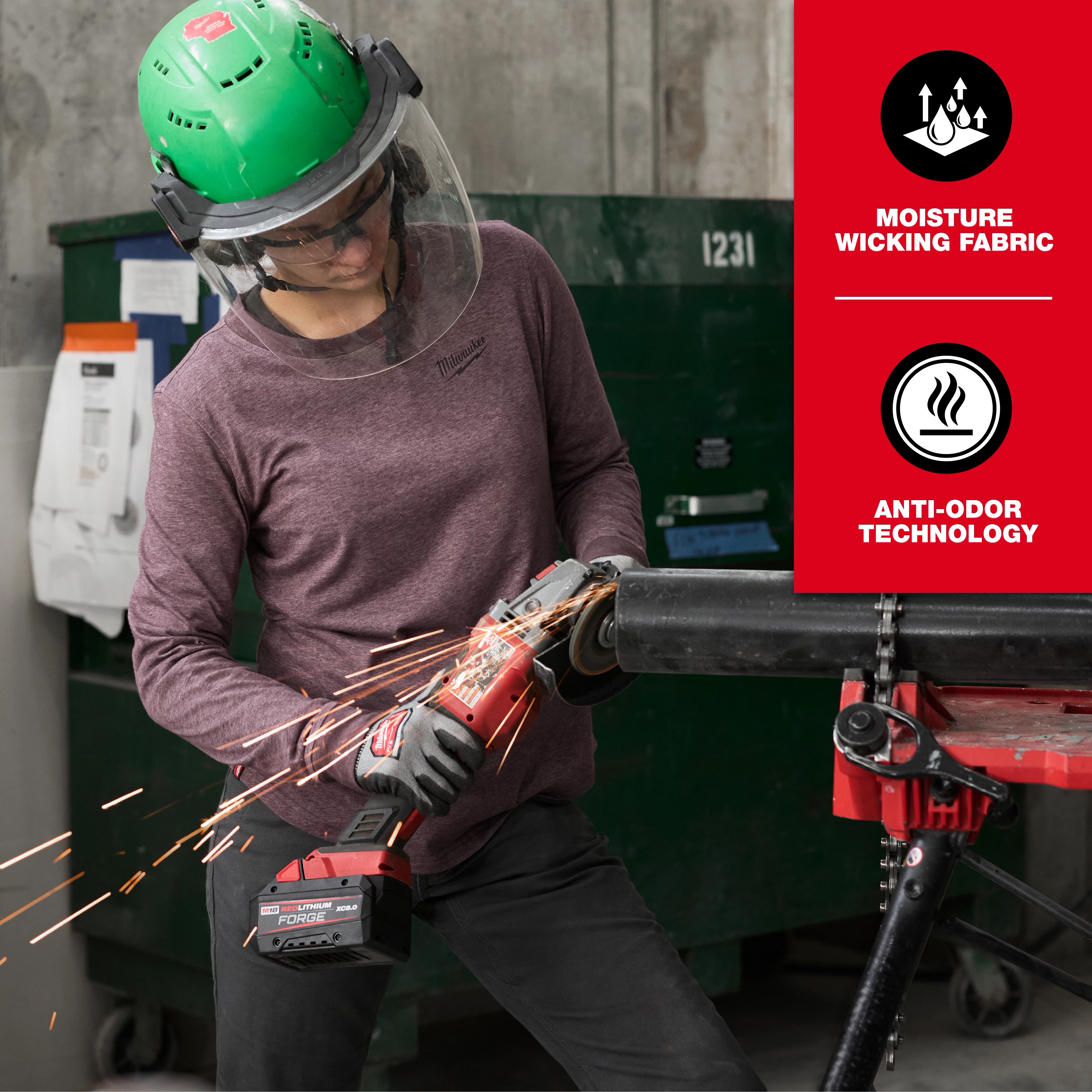 A person is using an angle grinder, wearing safety gear and the Women's FREEFLEX™ Hybrid Tee - Long Sleeve in purple. The shirt features moisture-wicking fabric and anti-odor technology as noted in the text on a red background on the right side of the image.