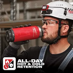 Worker holding a red App%20Shot%20Overlay stainless steel insulated bottle with "All-Day Hot & Cold Retention" text at the bottom.