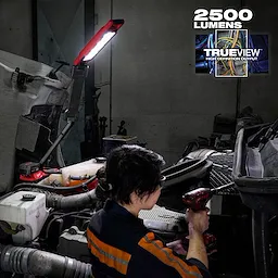 Image of a mechanic using the Milwaukee M18 Magnetic Extendable Boom Light on the jobsite