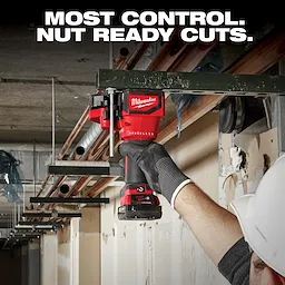 A person wearing work gloves and a hard hat uses a Milwaukee Brushless power tool to cut a metal beam. The image highlights the tool's ability to make precise cuts, as suggested by the text, "MOST CONTROL. NUT READY CUTS."