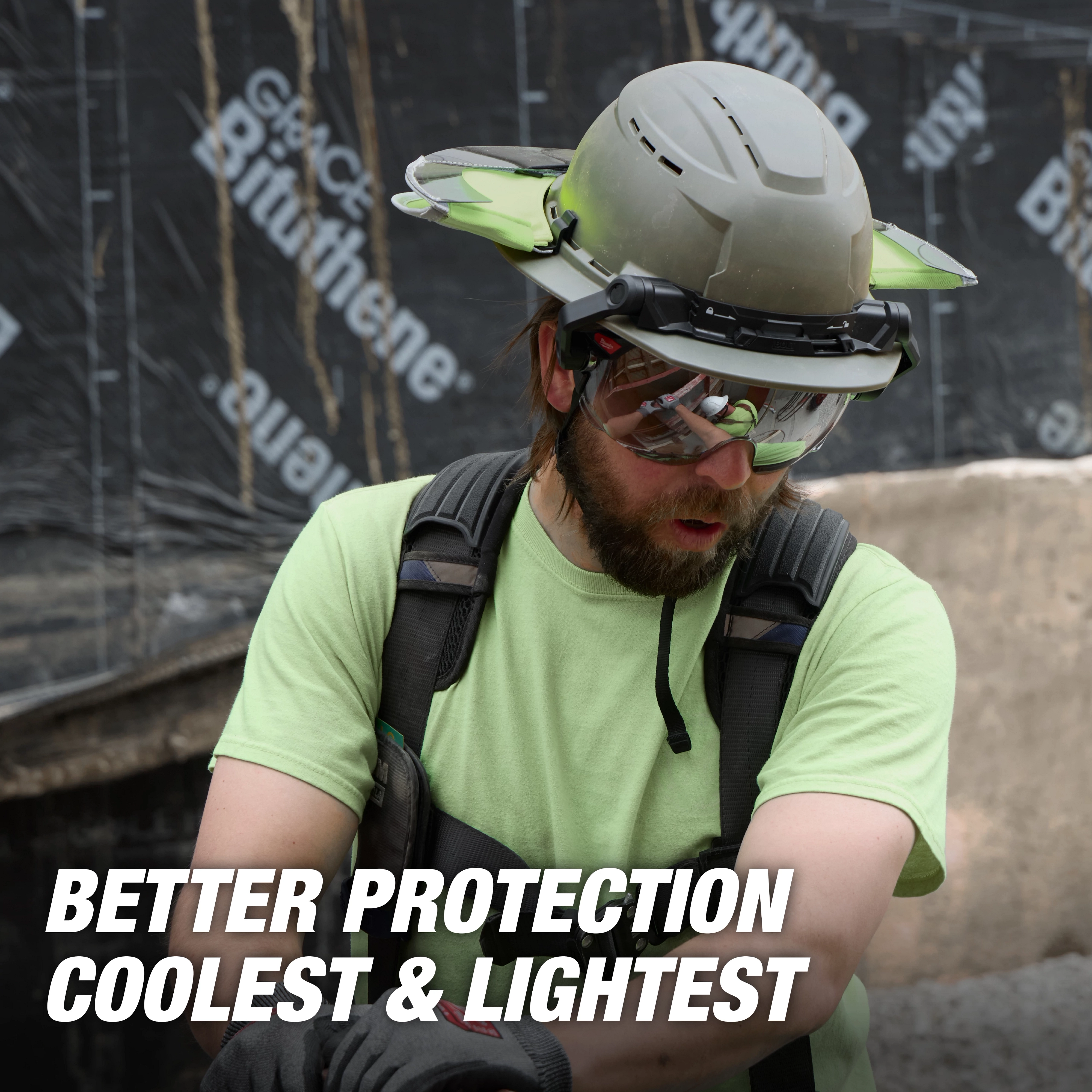 The BOLT™ Full Brim Safety Helmet is worn by a construction worker in a green shirt and black harness. The helmet features built-in attachments and provides enhanced protection. Text on the image reads, "BETTER PROTECTION COOLEST & LIGHTEST."
