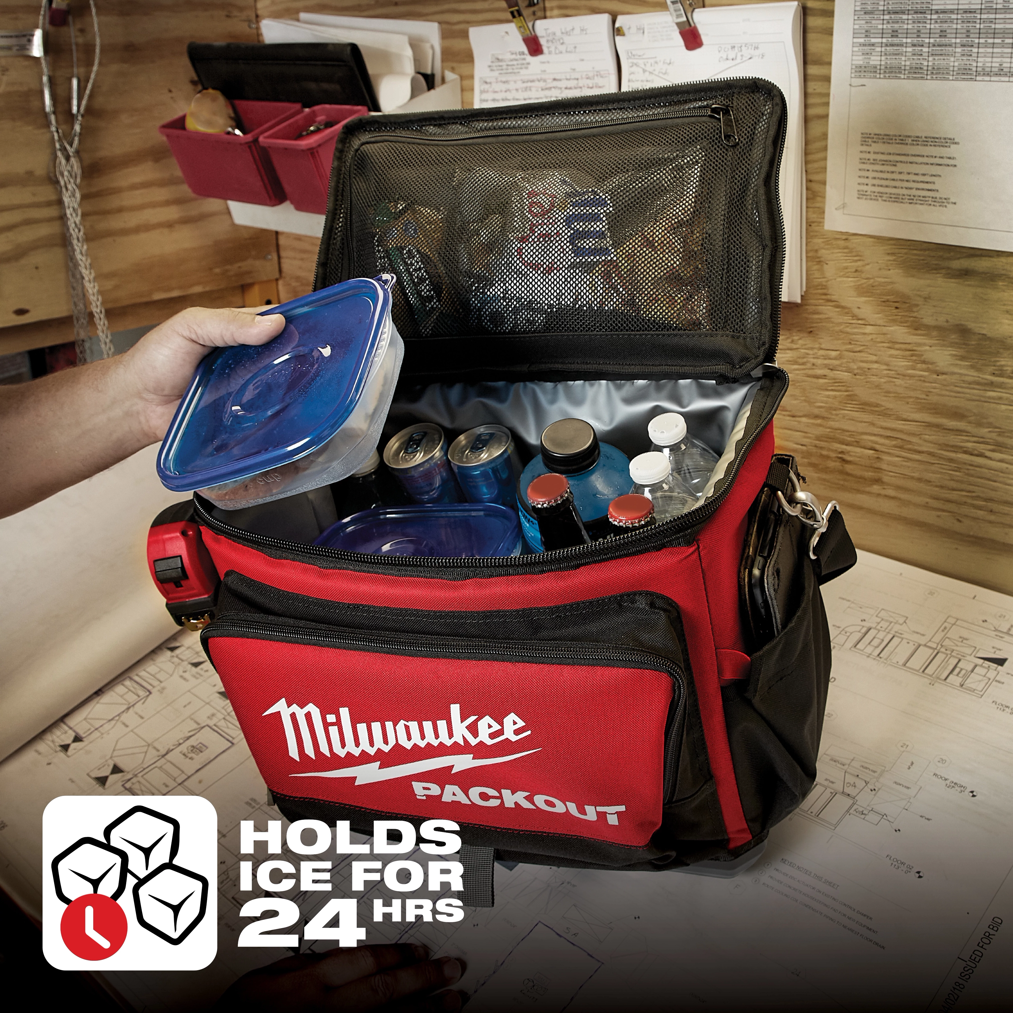Milwaukee Packout cooler bag with beverages being placed inside. Text overlay reads "Holds Ice for 24 hrs." App%20Shot%20Overlay.