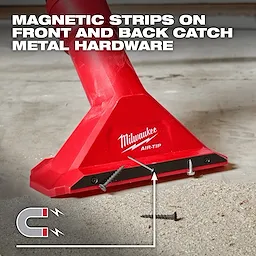 A red Milwaukee AIR-TIP™ 2 1/2" Magnetic Utility Nozzle is shown picking up screws from a floor. Text at the top states, "MAGNETIC STRIPS ON FRONT AND BACK CATCH METAL HARDWARE." The nozzle is attached to a vacuum cleaner and has screws adhered to its magnetic strip.