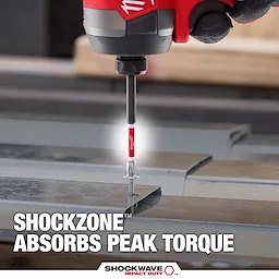 The image shows a SHOCKWAVE™ SHOCKZONE™ Philips Bit being used with a power tool to drive a screw into metal. Text on the image highlights that the SHOCKZONE™ technology absorbs peak torque, enhancing durability. The product branding "SHOCKWAVE IMPACT DUTY™" is visible at the bottom.