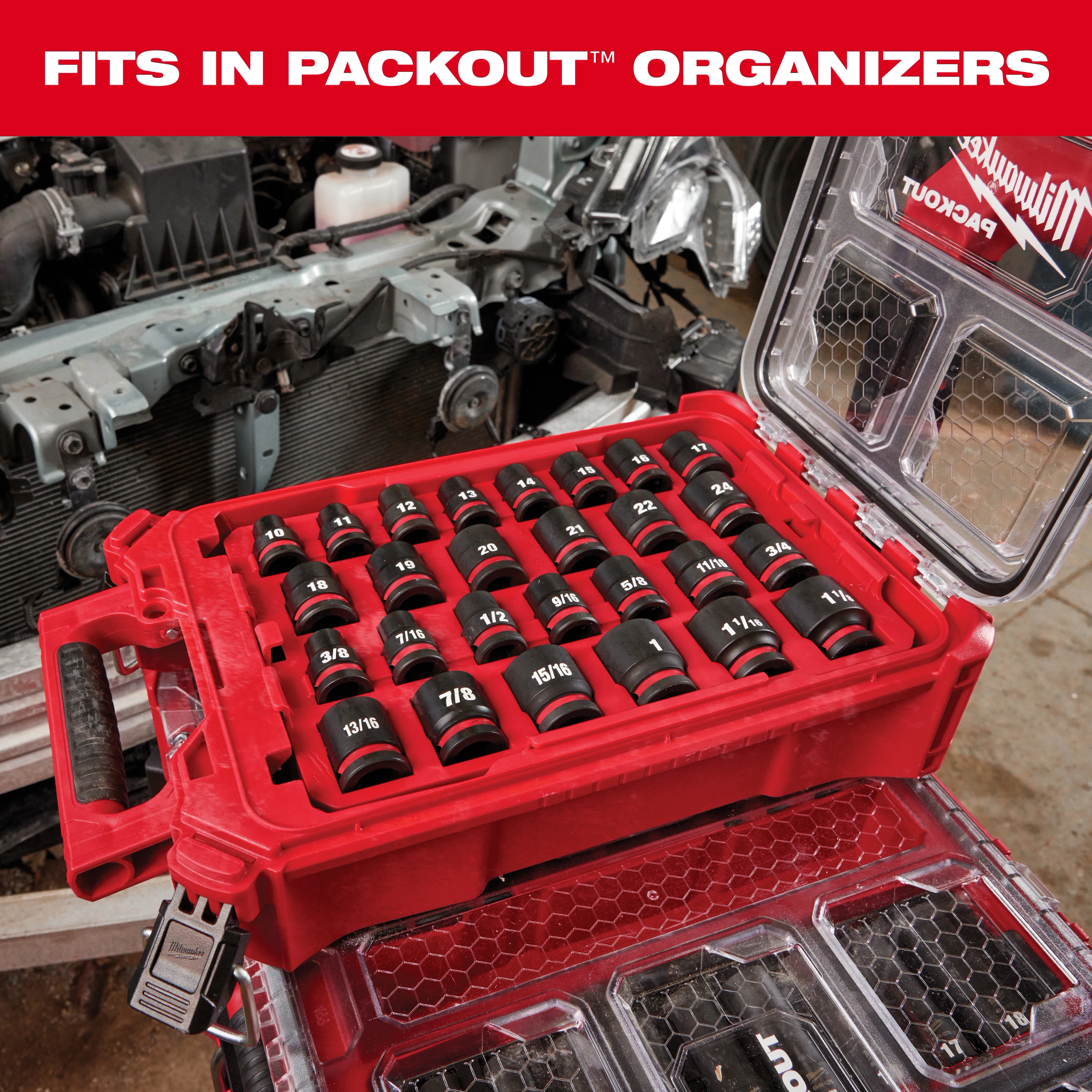 PACKOUT™ PTA Sockets set is displayed in a red organizer case, arranged in rows. Sockets are labeled with sizes ranging from 3/8 to 1 3/8 inches. The case lid is open, and sockets are securely stored. Background shows automotive parts, emphasizing tool use in mechanical work.