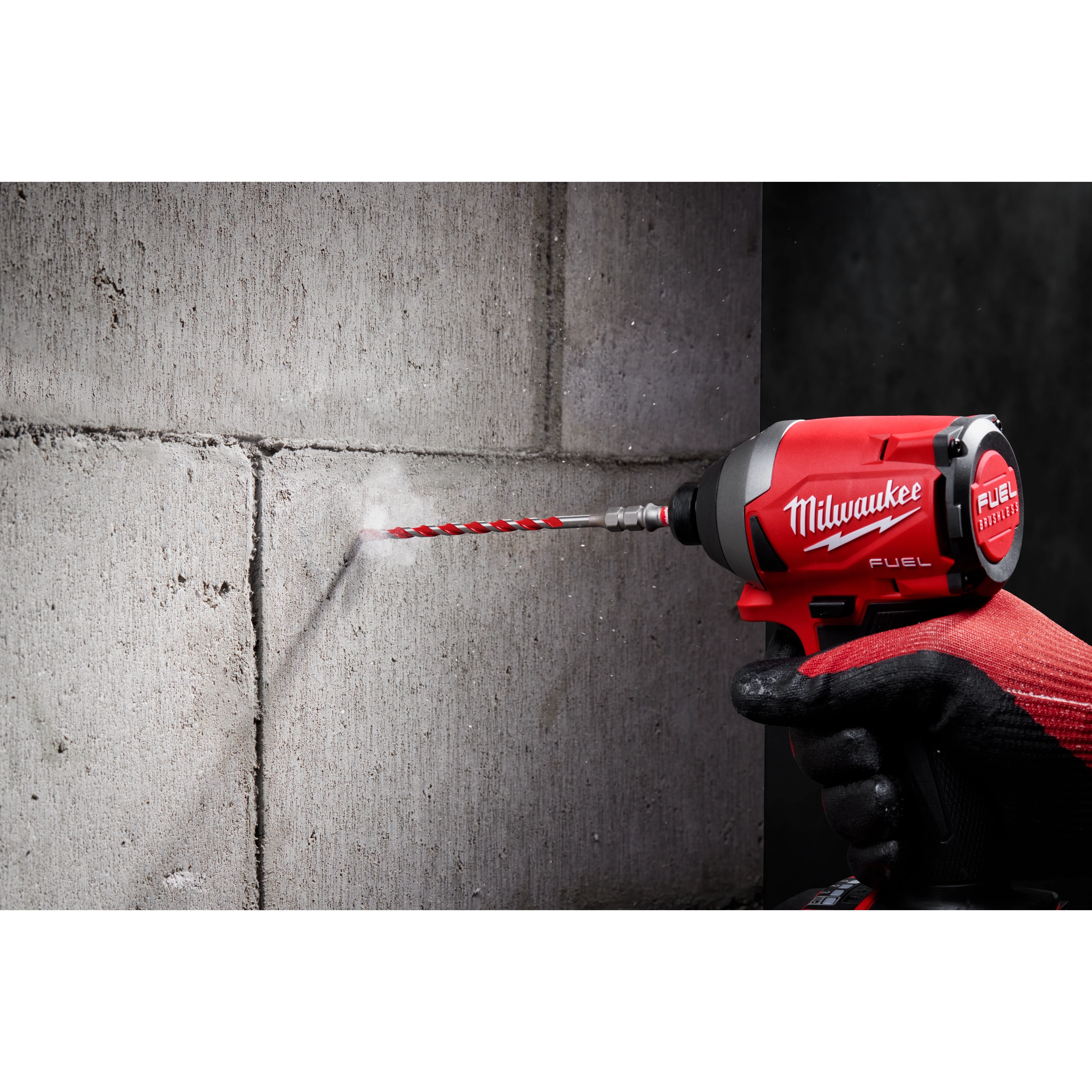 Worker using the Hammer Drill Bit Conrete Screw Installation tool