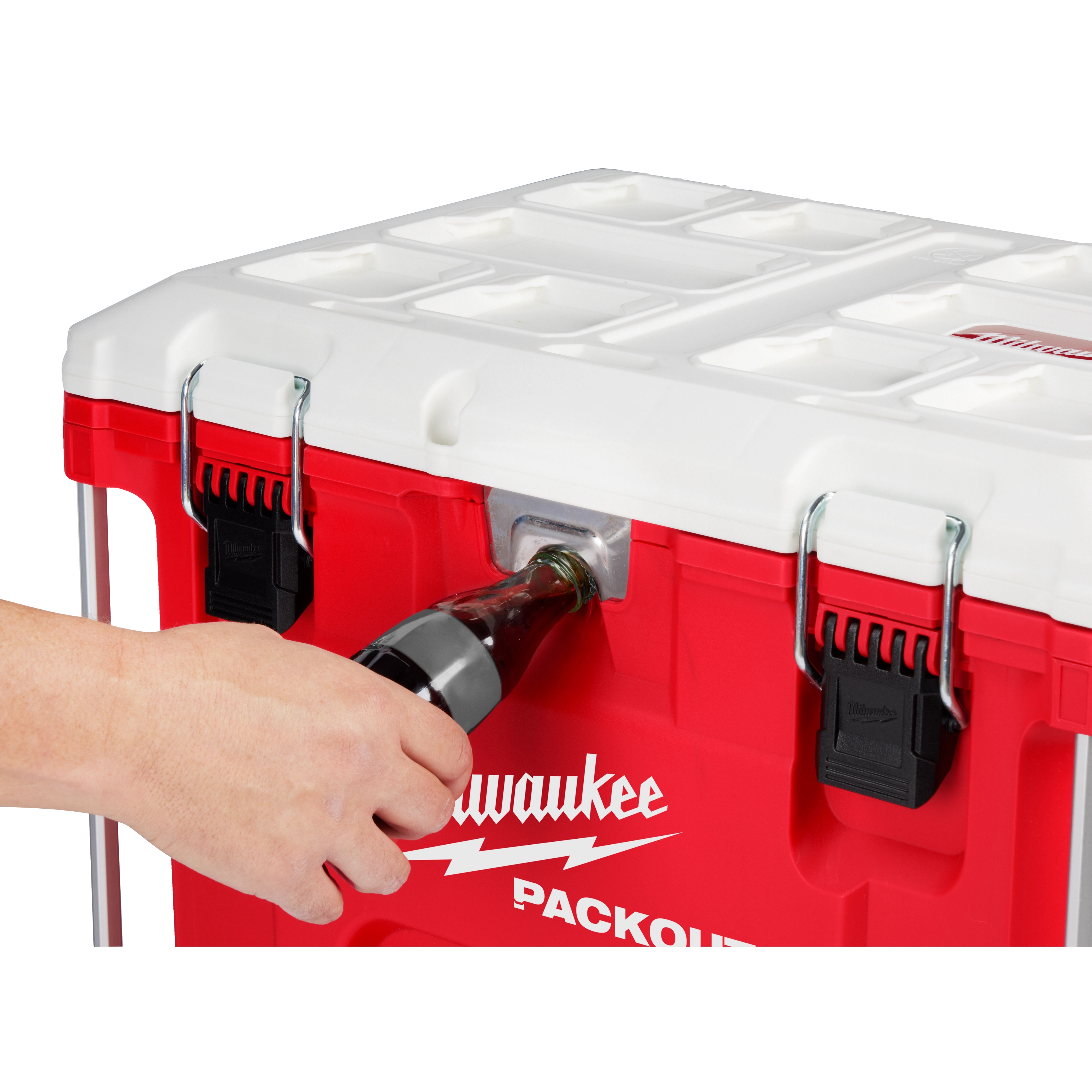 Worker using the integrated bottle opener attached to the PACKOUT Cooler