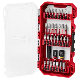 A Milwaukee tool set in a red case with a clear lid. It contains multiple screwdriver bits arranged in rows, along with adapters and extensions held securely in place. The lid features a faint Milwaukee logo.